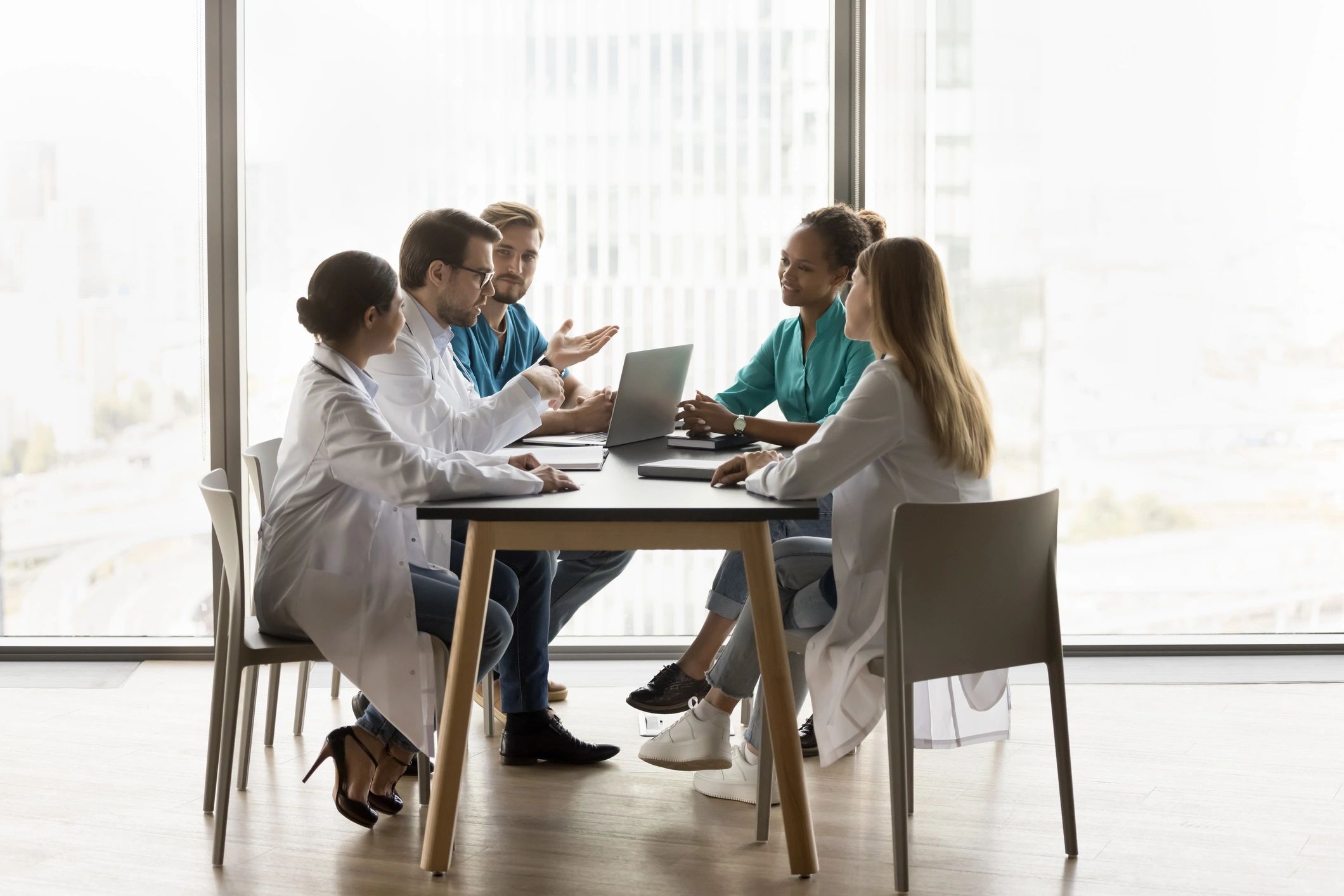 Healthcare team meeting around a table