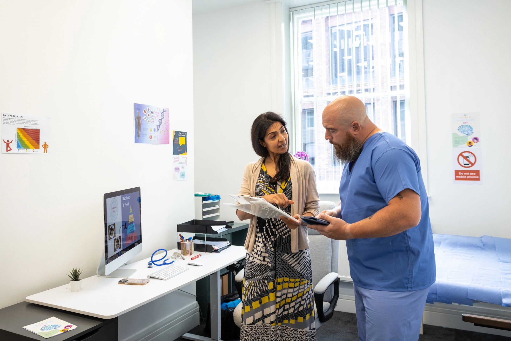 Healthcare professionals reviewing patient notes