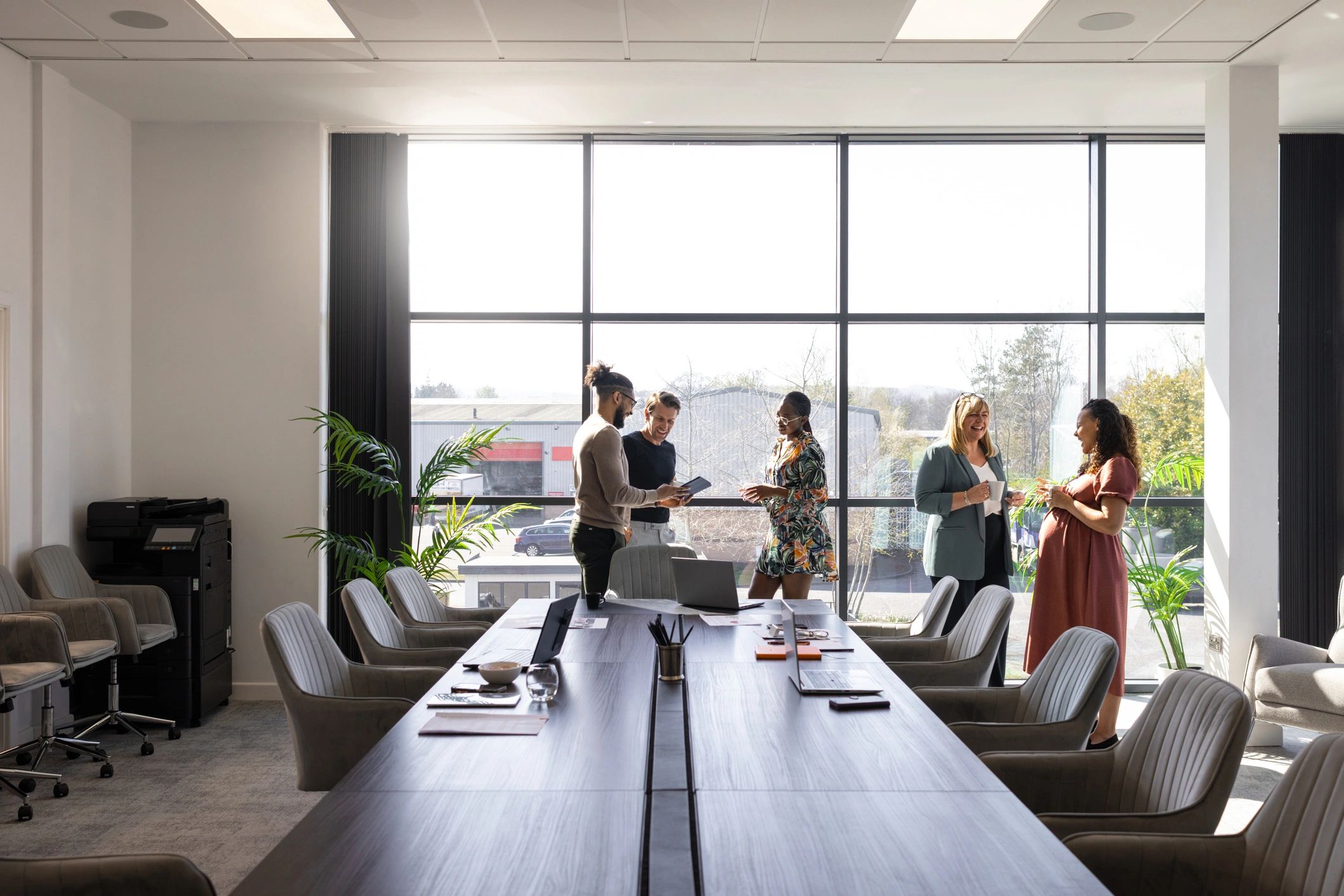 Professional team discussing work in a bright office